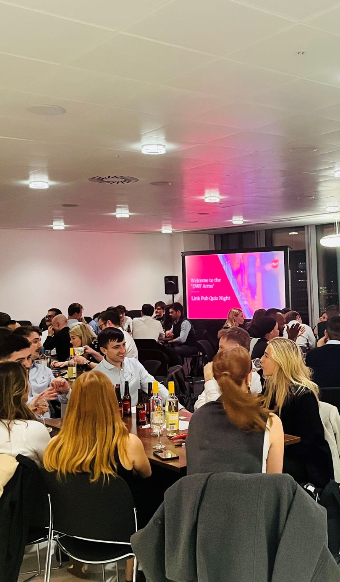 A group of people attending the Link pub quiz night at the DWF offices