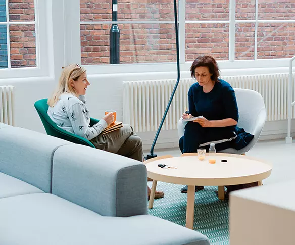 Meeting in open plan office