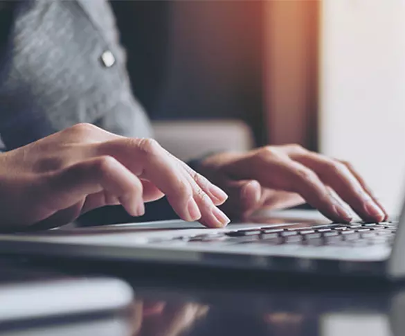 0758 Working on laptop 585px x 485px